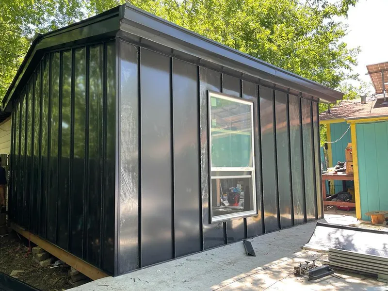 Black standing seam metal wall panels for Roof Inspection in Harris