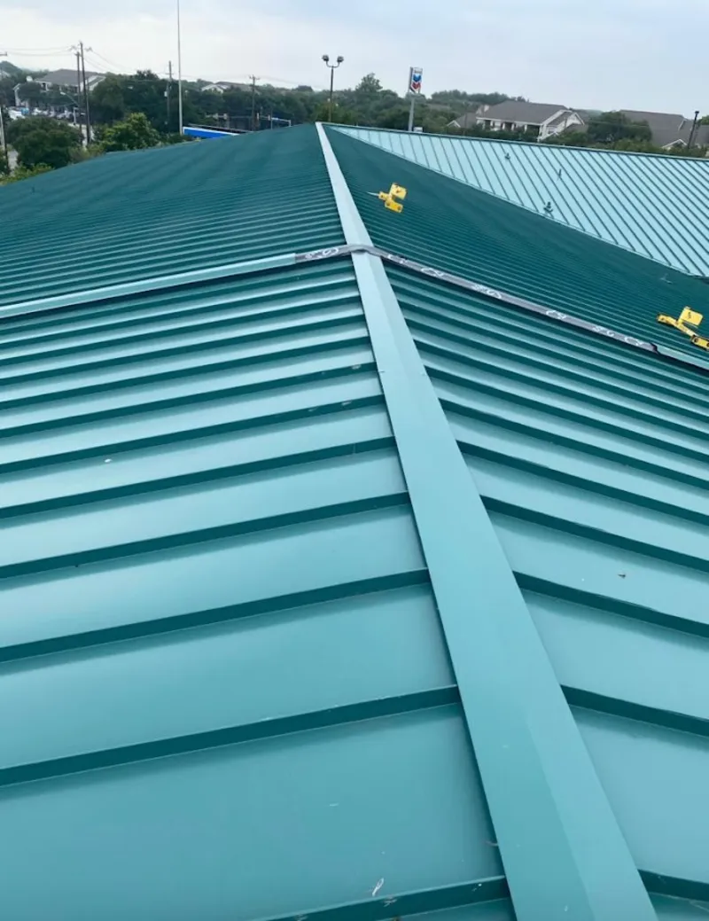 Green commercial metal roof ridge and valley for Metal Roof Repair in Harris